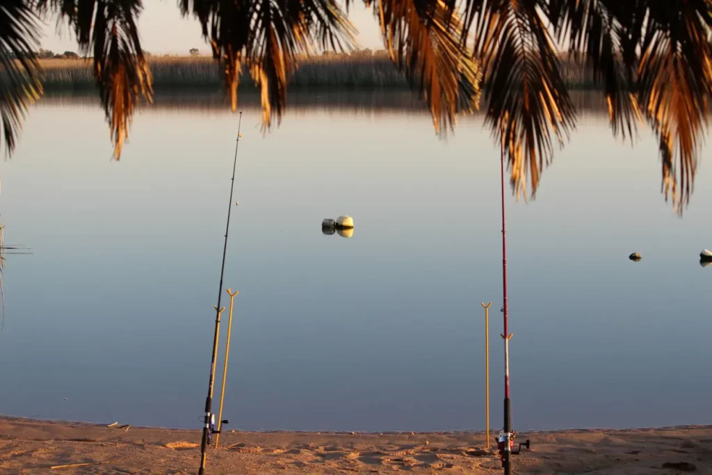 A view of the river with fishing rods on one of the best camping sites on the west coast of South Africa, Kliprivier river resort.