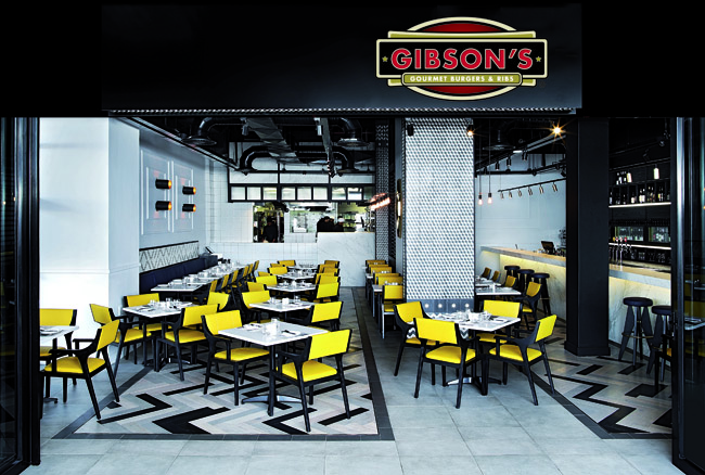 eye-catching yellow chairs stand out against the white and black floors and ceilings, almost cafe-esque seating another iconic venue amongst the restaurants in waterfront