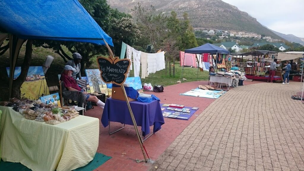 Market stalls along the brick path in this park, with beautiful mountains looming in the background, another fantastic Hout Bay Market