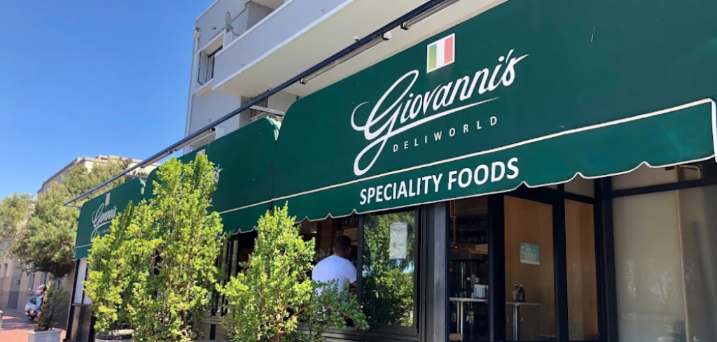 The green branded awning hanging over the streetside entrance of Giovanni's Deliworld, another great place for breakfast Cape Town has to offer