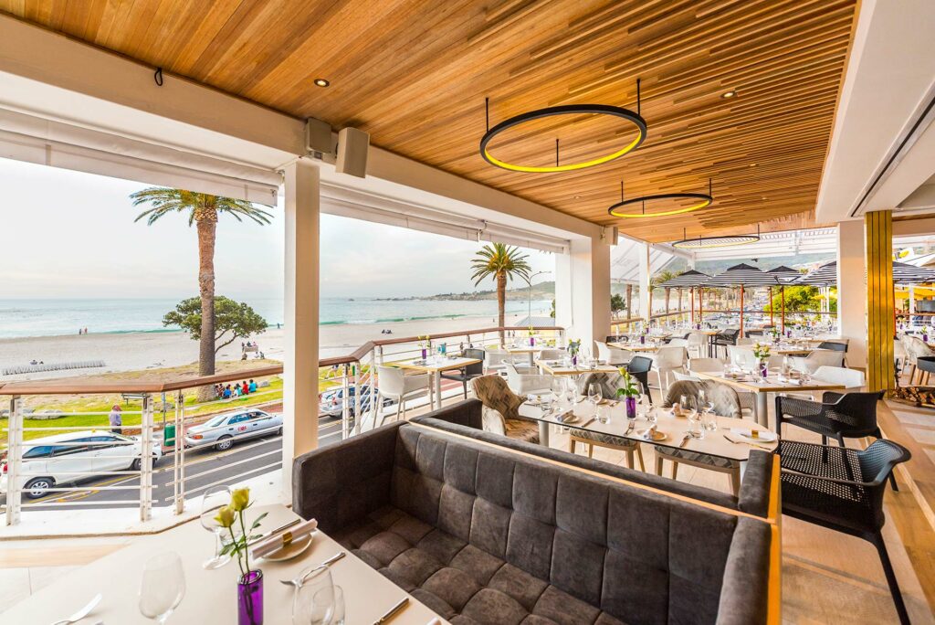 The beautiful seating of this restaurant in Camps Bay provides stunning views of the beach and ocean