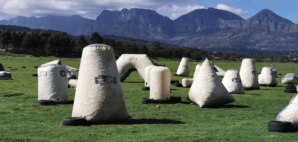 Paintball field with inflatable cover, mountains visible in background an example of what paintball Cape Town has to offer