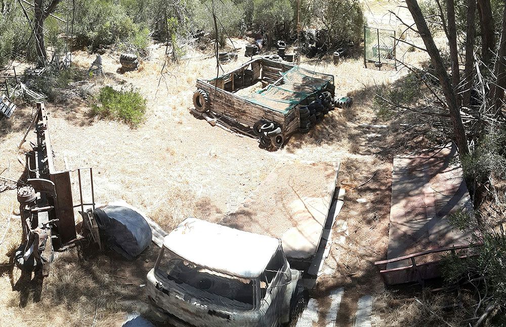 One of the playing fields at this venue featuring old cars and structures for cover, just an example of what paintball Cape Town has to offer