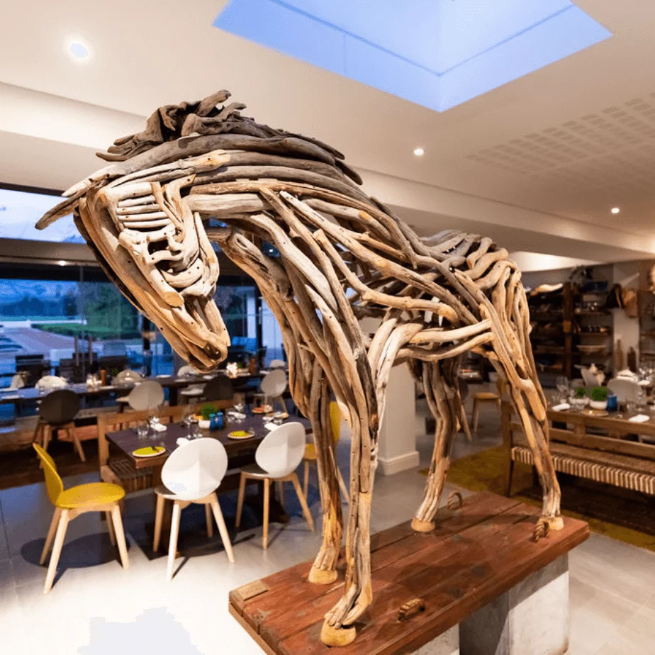 A horse sculpture made from pieces of wood, and the centerpiece of this Somerset West restaurant