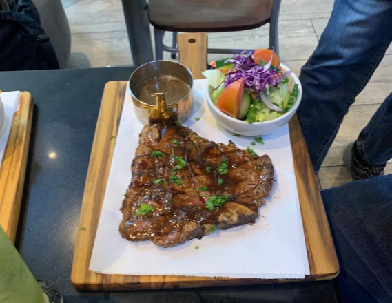 a beautifully presented steak with a side salad, just one example of the wonderful food available at this restaurant in Century City